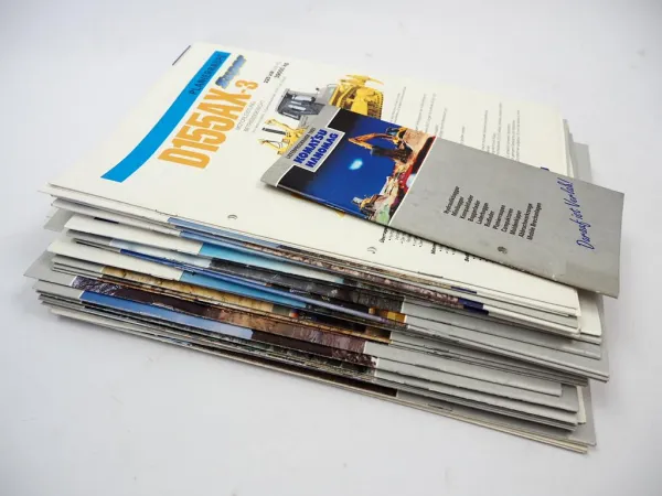 Posten mit ca. 50x Prospekt Komatsu Bagger Radlader Kipper 1980/90/2000er Jahre