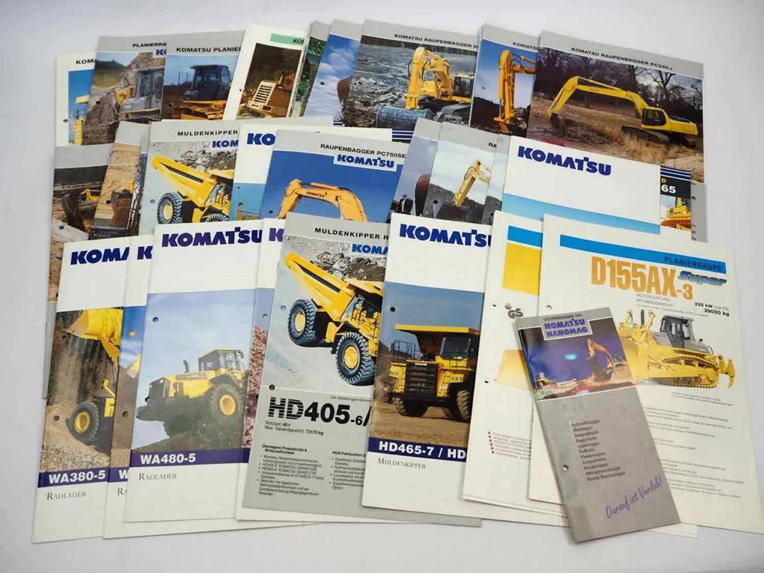 Posten mit ca. 50x Prospekt Komatsu Bagger Radlader Kipper 1980/90/2000er Jahre